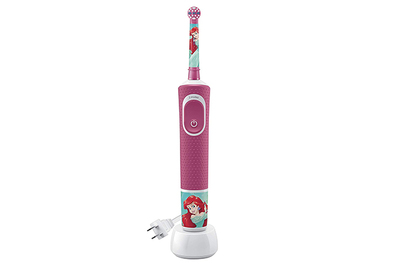 Young Girl With Electric Toothbrush